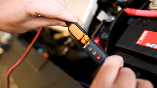 CTEC INDICATOR EYELET connected to a car battery charger