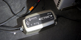 CTEK battery charger MXS 10 on a textured surface